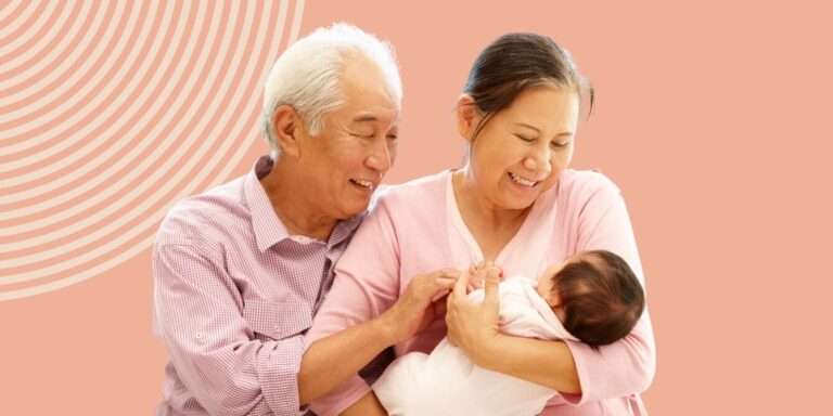 grandparents holding grandbaby