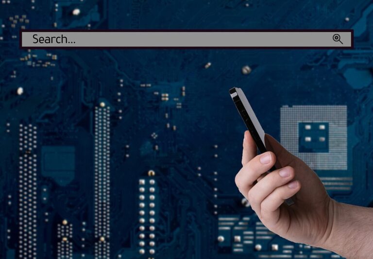 Business and technology concept hand holding smartphone and search bar 52917310335 e1743968484196